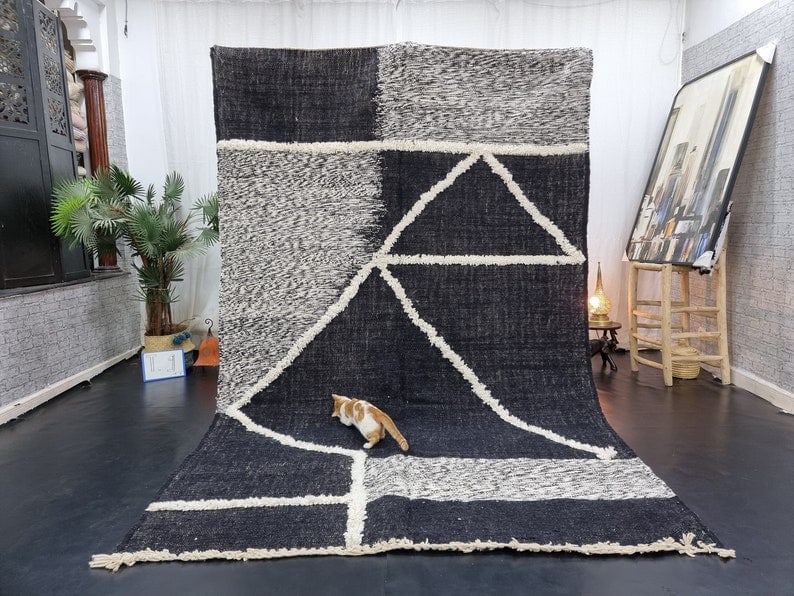 Authentic Black Grey Handmade Moroccan Berber Wool Rug 8 x 5 Feet: Authentic Black Grey Handmade Moroccan Berber Wool Rug 8 x 5 Feet Experience the beauty of Moroccan craftsmanship with this authentic Black & Grey Handmade Berber Wool Rug. Meticulously handwoven in t
