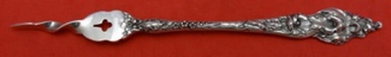 Reed and Barton Les Six Fleurs Sterling Silver Butter Pick 6.5": Reed and Barton Les Six Fleurs Sterling Silver Butter Pick 6.5" This exquisite butter pick is crafted from high-quality sterling silver and features the elegant Les Six Fleurs pattern by Reed & Barton