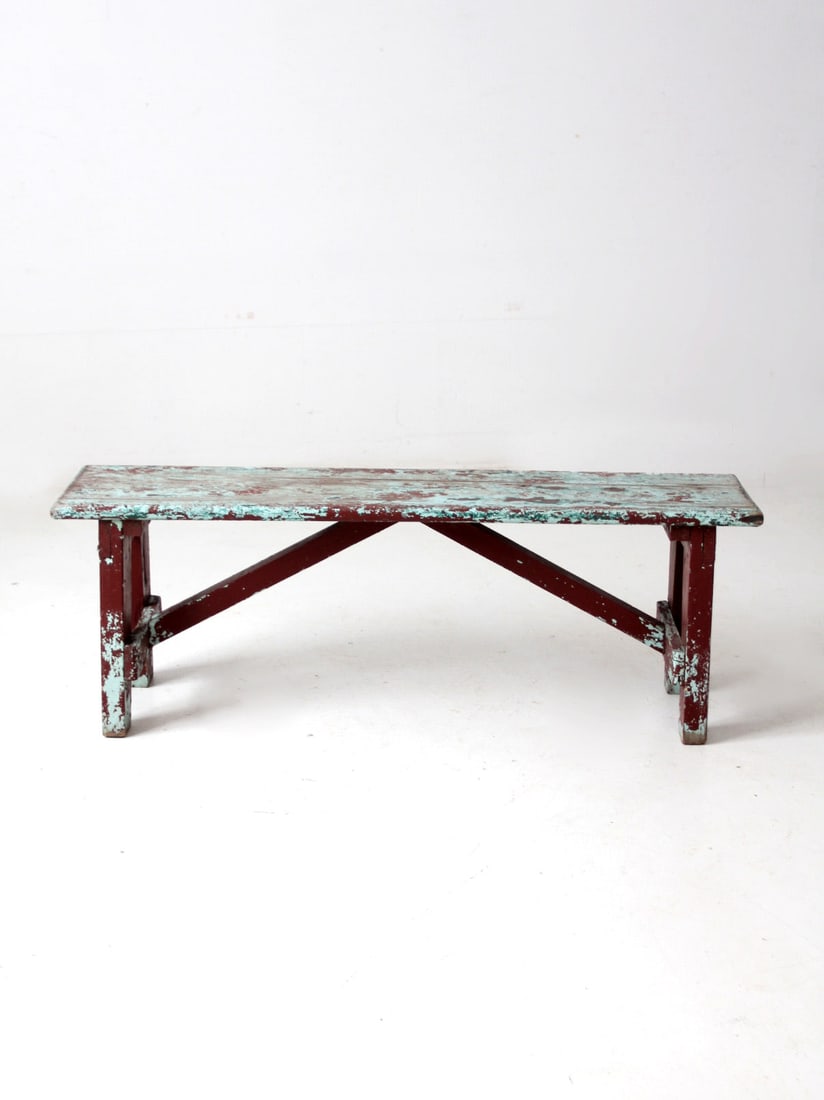 Antique Maroon Wood Bench with Turquoise Top: Antique Maroon Wood Bench with Turquoise Top This antique primitive wood bench showcases a charming maroon finish with a striking turquoise blue top. Designed with cross bar braces on the back, this v