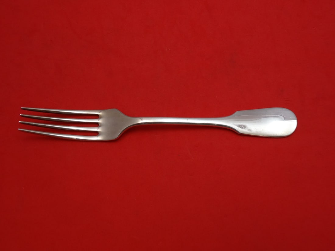 Carrs Fiddle Sterling Silver Regular Fork 7 1/8": Carrs Fiddle Sterling Silver Regular Fork 7 1/8" This exquisite 7 1/8" regular fork showcases the elegant Fiddle pattern by Carrs, expertly crafted from high-quality sterling silver. The piece is unmo