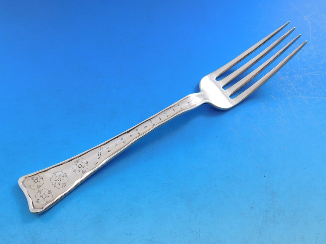 Tiffany & Co. Sterling Silver Dinner Fork Lap Over Edge Cherry Blossoms 8 1/8": Tiffany & Co. Sterling Silver Dinner Fork Lap Over Edge Cherry Blossoms 8 1/8" This exquisite dinner fork, crafted by Tiffany & Co., features the elegant Lap Over Edge pattern, showcasing beautiful en