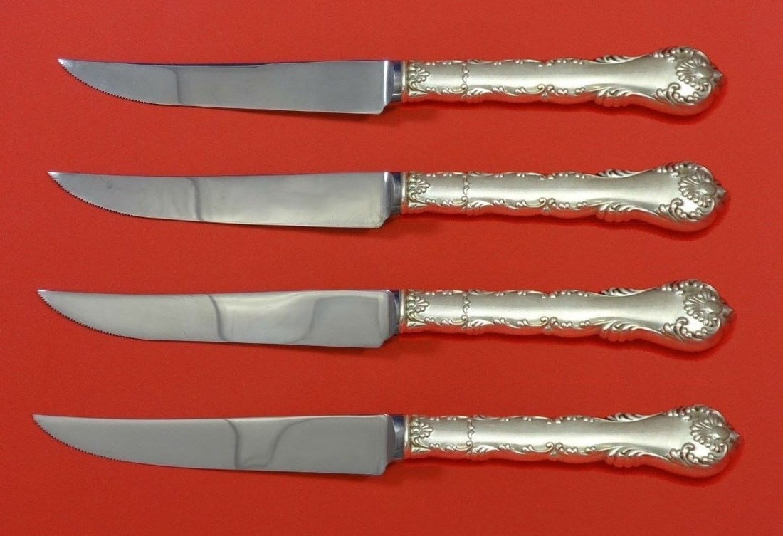 Frank Whiting Kings Court Sterling Silver Steak Knife Set 4pc: Frank Whiting Kings Court Sterling Silver Steak Knife Set 4pc Indulge in the elegance of the Kings Court Sterling Silver Steak Knife Set, crafted by Frank Whiting. This exquisite 4-piece set features 