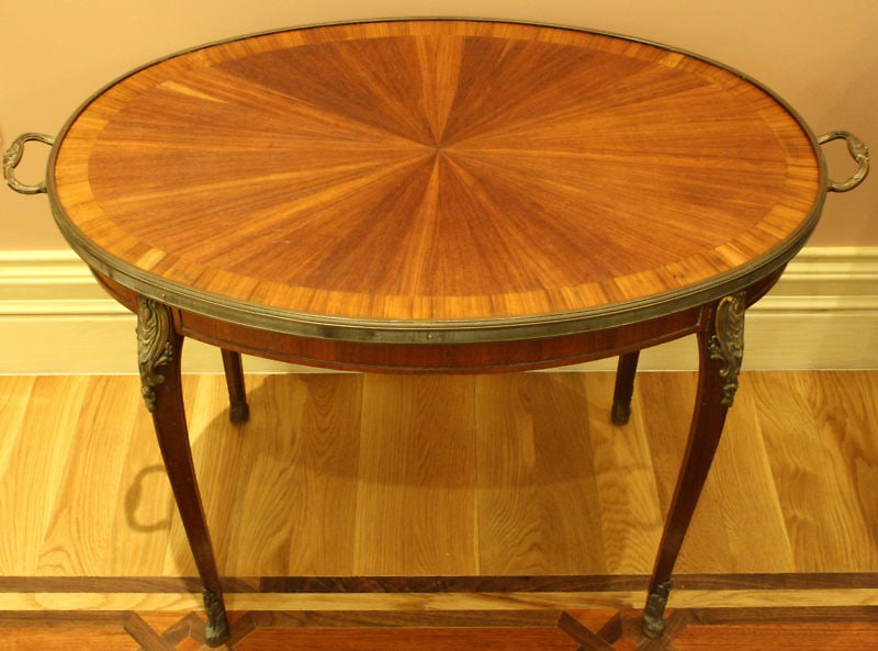 19th Century French Inlaid Mahogany Coffee Table with Bronze Details: 19th Century French Inlaid Mahogany Coffee Table with Bronze Details This exquisite 19th-century French coffee table showcases a stunning inlaid mahogany design complemented by intricate bronze detail