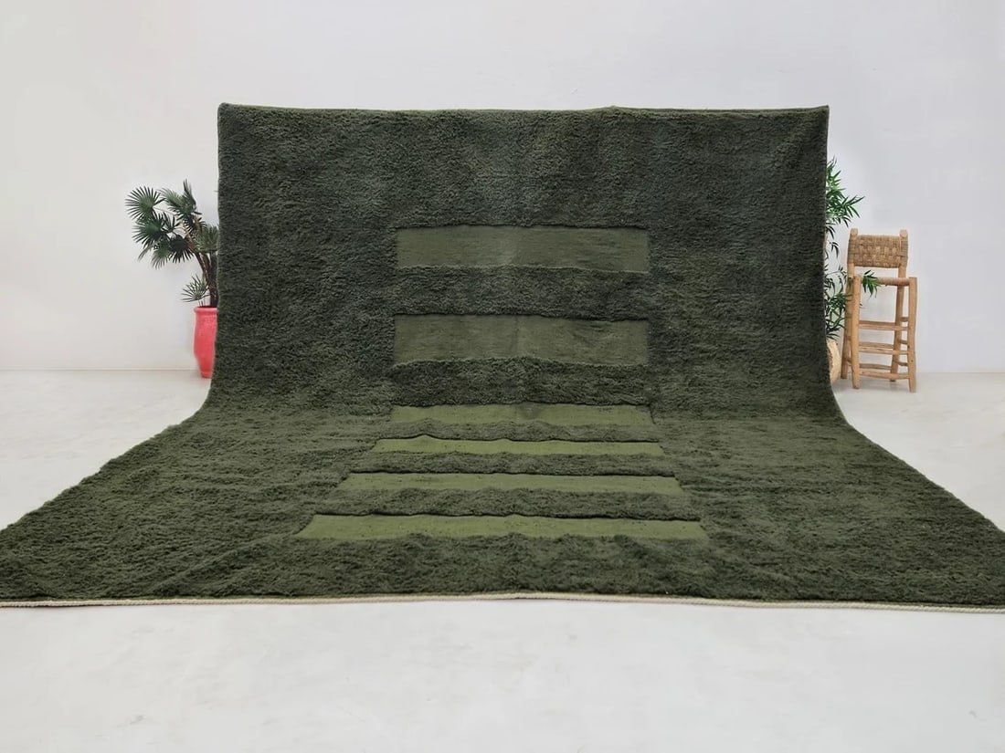 Elegant Dark Green Handmade Engraved Wool Rug from Morocco: Elegant Dark Green Handmade Engraved Wool Rug from Morocco Discover the beauty of this Elegant Dark Green Soft Handmade Engraved Wool Rug, meticulously handwoven in the Atlas Mountains by skilled loca