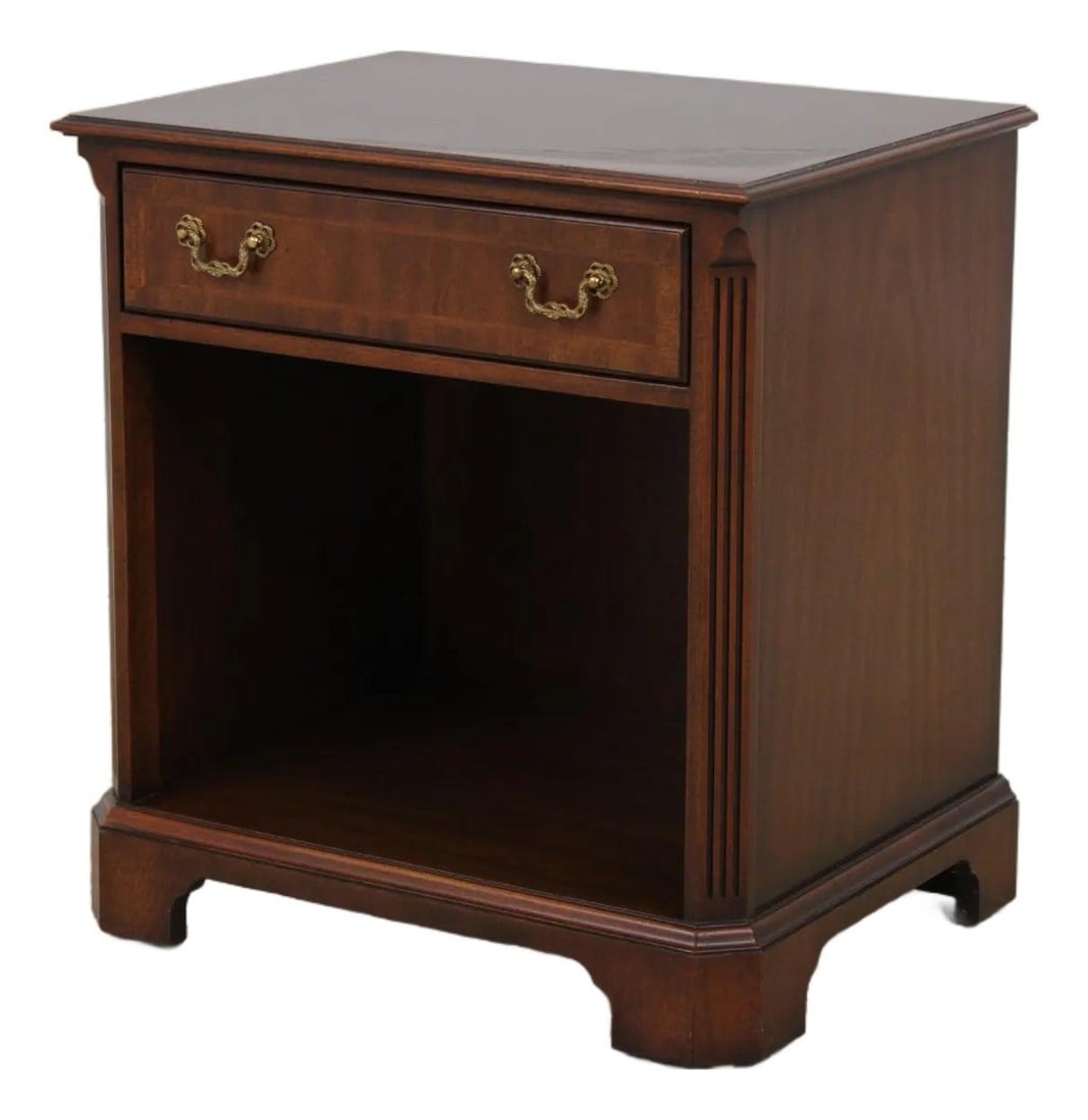 Mahogany Chippendale Nightstand by Kindel 24w x 18d x 26h: Mahogany Chippendale Nightstand by Kindel 24w x 18d x 26h This Chippendale style nightstand features high-quality mahogany construction with traditional bracket feet, quarter column sides, and a herri