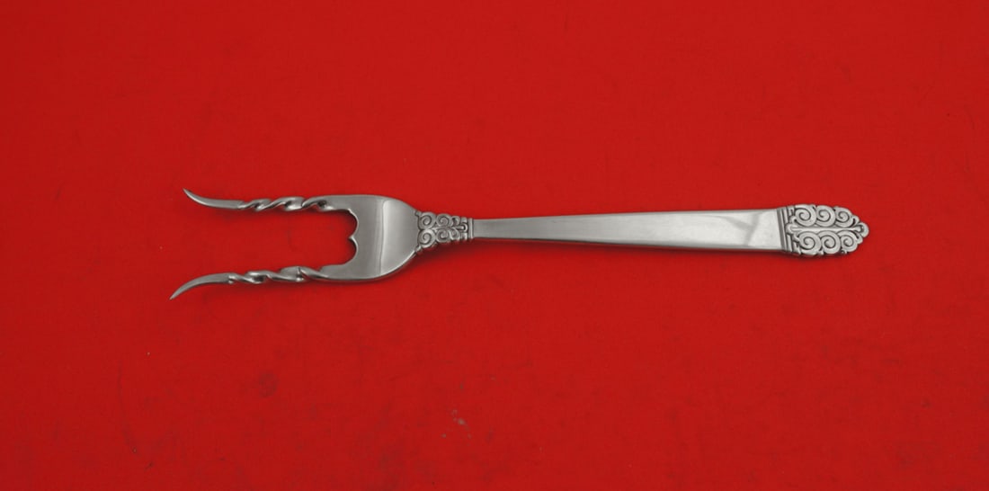 International Silver Northern Lights Sterling Silver Baked Potato Fork 7 1/4": International Silver Northern Lights Sterling Silver Baked Potato Fork 7 1/4" Elevate your dining experience with this exquisite Baked Potato Fork from the Northern Lights pattern by International Ste