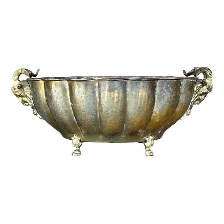 Vintage Regency Brass Rams Head Jardiniere 17x11.5x7.25: Vintage Regency Brass Rams Head Jardiniere 17x11.5x7.25 Elevate your decor with this stunning Vintage Regency Brass Ram's Head Jardiniere. This exquisite piece features a hand-hammered body adorned wi