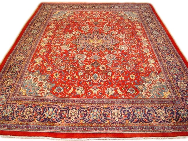 9.9 x 13 Red Semi Antique Persian Sarouk Rug Handmade in Iran: 9.9 x 13 Red Semi Antique Persian Sarouk Rug Handmade in Iran Free continental US Shipping Enhance your living space with the timeless elegance of this 9.9 x 13' Red Semi Antique Persian Sarouk Rug. H