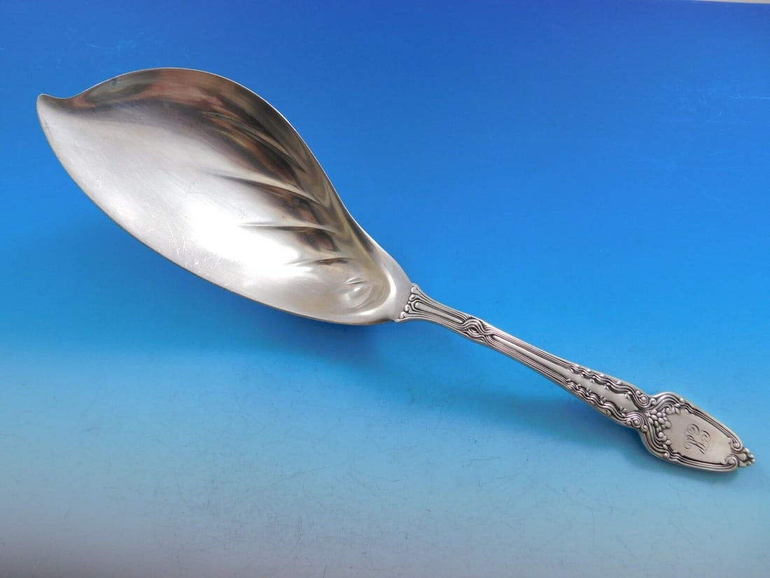 Tiffany & Co. Broom Corn Sterling Silver Ice Cream Server Dolphin 11 3/8": Tiffany & Co. Broom Corn Sterling Silver Ice Cream Server Dolphin 11 3/8" This exquisite ice cream server, crafted by Tiffany & Co., features a stunning dolphin-shaped blade. Measuring 11 3/8" in leng