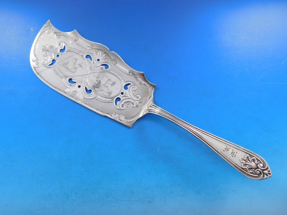 Wood & Hughes Leaf Sterling Silver Fish Server 11 1/2": Wood & Hughes Leaf Sterling Silver Fish Server 11 1/2" Discover the exquisite craftsmanship of this Sterling Silver Fish Server from the renowned Wood & Hughes, part of the elegant Leaf pattern. Measu