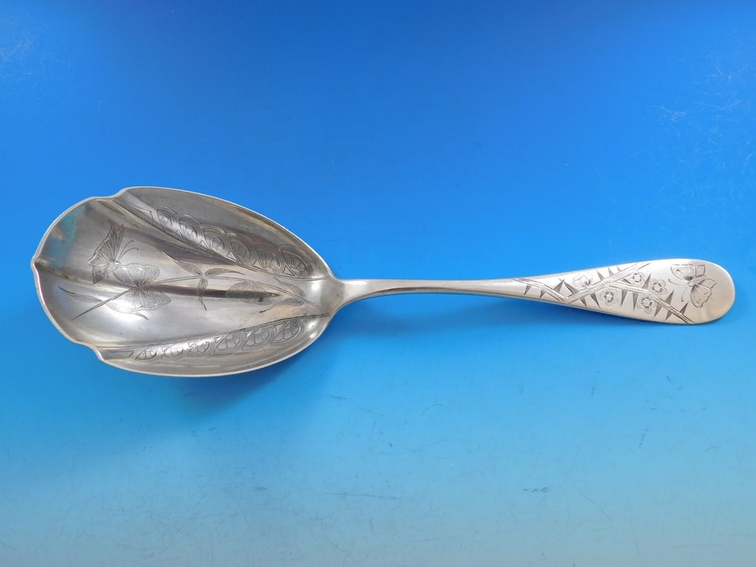 Durgin Sterling Silver Brite-Cut Butterfly Berry Spoon 9 1/4 Inches: Durgin Sterling Silver Brite-Cut Butterfly Berry Spoon 9 1/4 Inches This sterling silver berry spoon by Durgin features a brite-cut design with butterfly motifs. Measuring 9 1/4 inches in length, it i