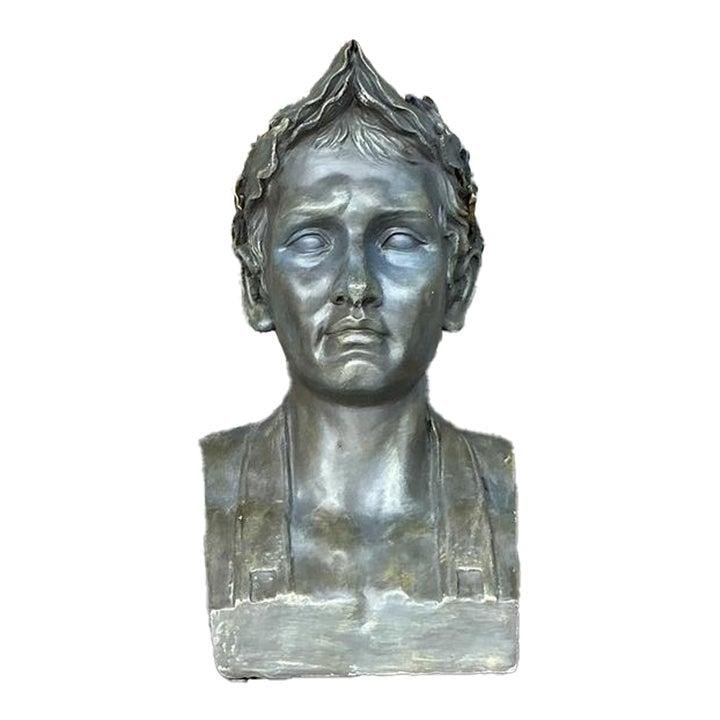 Neoclassical Plaster Bust With Laurel Wreath Aged Bronze Patina 18 Inch: Neoclassical Plaster Bust With Laurel Wreath Aged Bronze Patina 18 Inch This vintage neoclassical bust depicts a man with a serene expression and a traditional laurel wreath, inspired by classical Gre