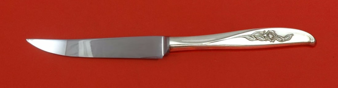 Wallace Penrose Sterling Silver Steak Knife Custom Serrated 8.5 Inch: Wallace Penrose Sterling Silver Steak Knife Custom Serrated 8.5 Inch Experience the elegance of dining with the Penrose steak knife by Wallace. This custom-made knife features a sterling silver hollow