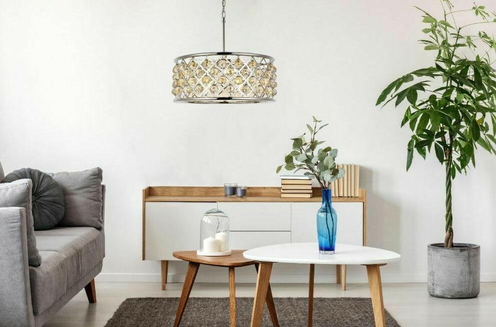 Madison 25 in Crystal Chandelier 6 Light Polished Nickel: Madison 25 in Crystal Chandelier 6 Light Polished Nickel This modern 6-light chandelier features a polished nickel finish with golden teak faceted royal cut crystal details. It is height-adjustable, h