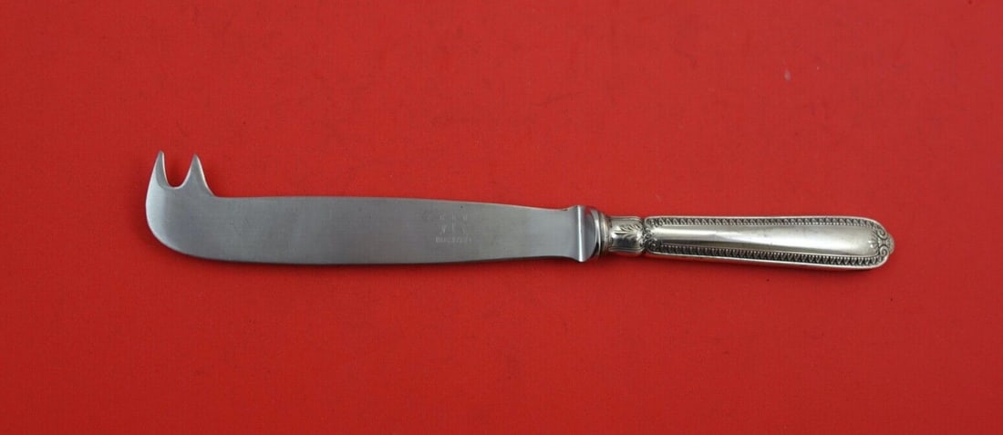 Italian Sterling Empire Pattern 8.5" Cheese Knife with 2 Prongs: Italian Sterling Empire Pattern 8.5" Cheese Knife with 2 Prongs This exquisite cheese knife from the Empire pattern by Italian Sterling features a stunning hollow handle crafted from sterling silver. 