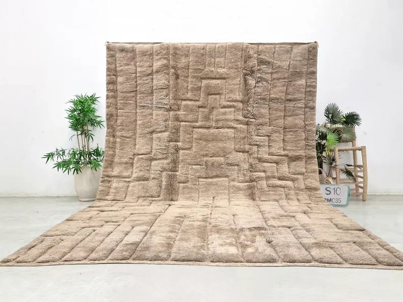 Authentic Handmade Engraved Wool Rug from Morocco 9.84 x 6.56 Feet: Authentic Handmade Engraved Wool Rug from Morocco 9.84 x 6.56 Feet Experience the elegance of this authentic handmade wool rug, meticulously crafted by skilled Berber women weavers in the Atlas Mounta