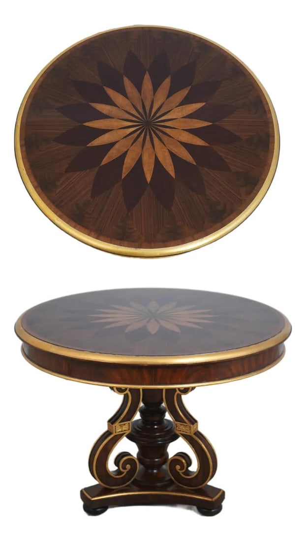 Maitland Smith mahogany center table with starburst marquetry inlay: Maitland Smith mahogany center table with starburst marquetry inlay This round center table features high-quality construction with a rich, high sheen finish. Crafted from mahogany, it showcases detai