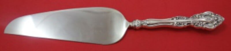 Oneida Michelangelo Sterling Silver Pie Server 10 3/4": Oneida Michelangelo Sterling Silver Pie Server 10 3/4" This exquisite pie server from the Michelangelo pattern by Oneida features a stunning sterling silver design. The hollow handle is complemented b