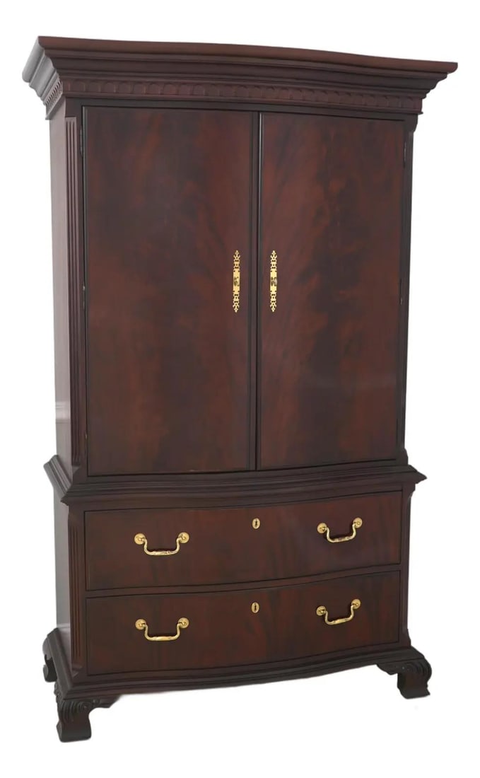 Mahogany Armoire Chest with Two Doors by Thomasville: Mahogany Armoire Chest with Two Doors by Thomasville This impressive two-door bedroom armoire chest features a traditional design crafted from figural mahogany. The piece includes quality dovetailed d