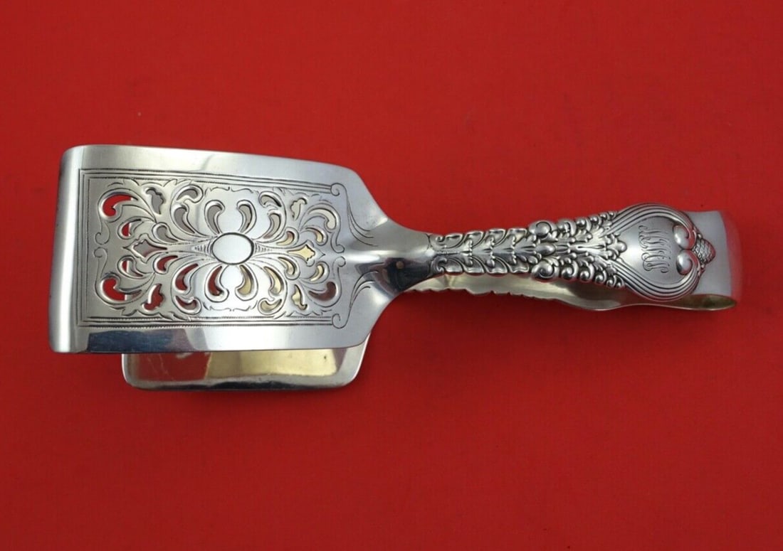 Tiffany & Co. Florentine Sterling Silver Asparagus Serving Tong 7 3/4": Tiffany & Co. Florentine Sterling Silver Asparagus Serving Tong 7 3/4" This exquisite Florentine asparagus serving tong by Tiffany & Co. is crafted from high-quality sterling silver, showcasing the el