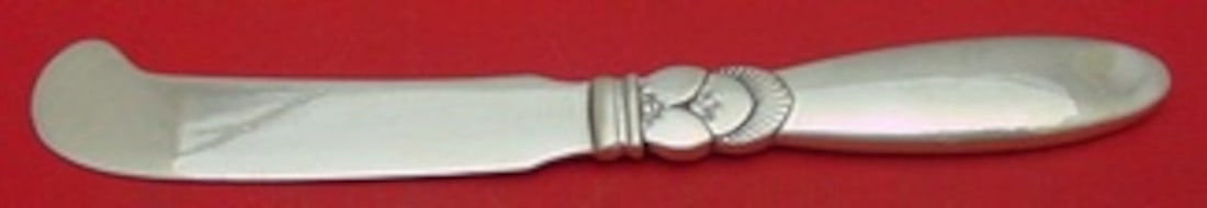 Sterling Silver Butter Spreader Cactus Pattern by Georg Jensen 6 1/8 Inch: Sterling Silver Butter Spreader Cactus Pattern by Georg Jensen 6 1/8 Inch This butter spreader features the renowned Cactus pattern by Georg Jensen, designed by sculptor Gundolph Albertus in 1930. Cra