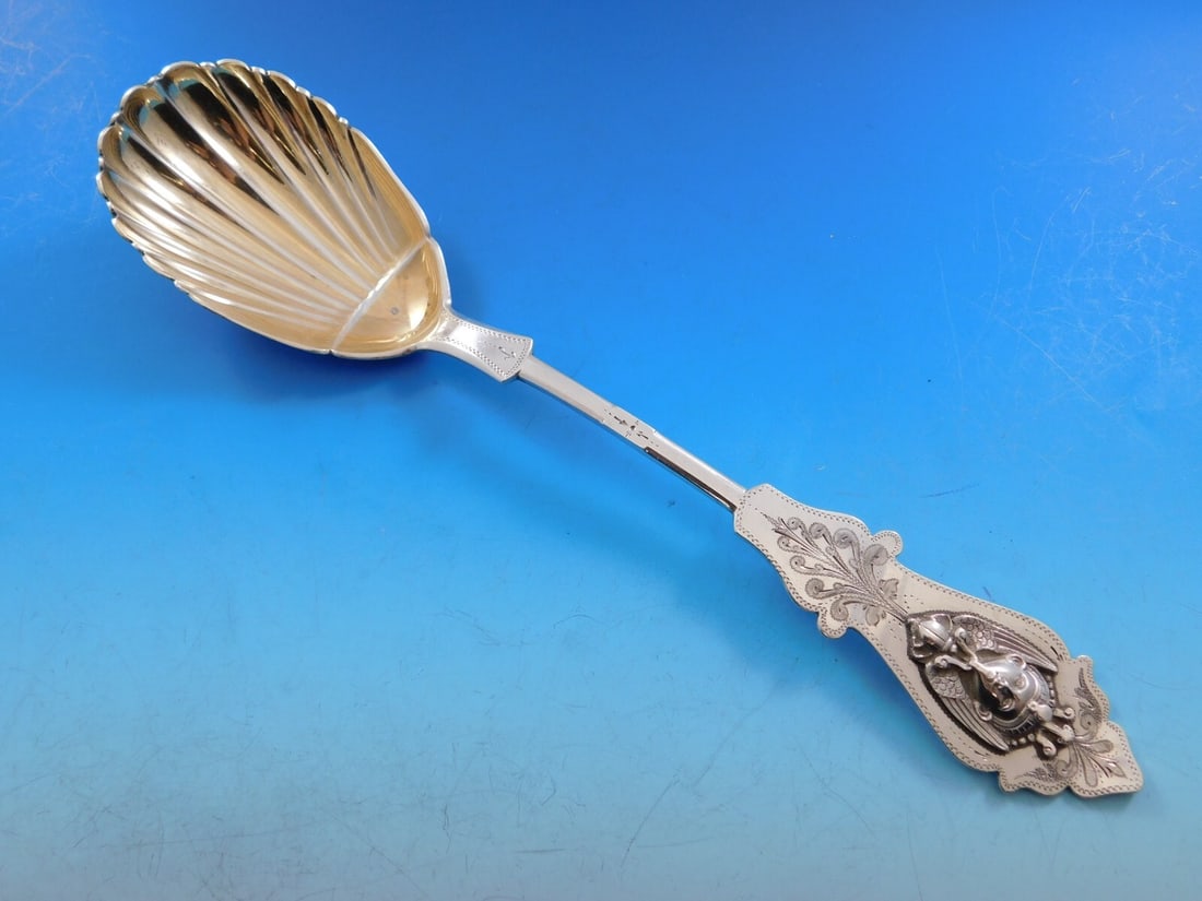 Duhme Egyptian Revival Sterling Silver Berry Spoon 9.5" Monogrammed: Duhme Egyptian Revival Sterling Silver Berry Spoon 9.5" Monogrammed Experience the exquisite craftsmanship of this Egyptian Revival berry spoon by Duhme. Crafted from sterling silver between 1850 and 