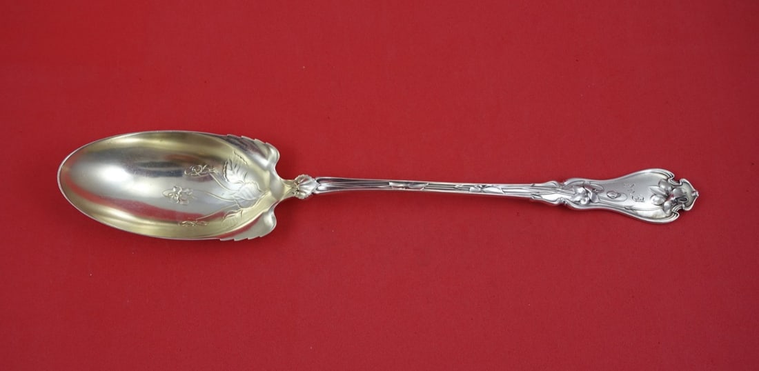 Whiting Violet Sterling Silver Serving Spoon Light Gold Wash 11 3/4: Whiting Violet Sterling Silver Serving Spoon Light Gold Wash 11 3/4 This is a Whiting Sterling Silver platter spoon in the Violet pattern, featuring a light gold wash finish. The spoon measures 11 3/4