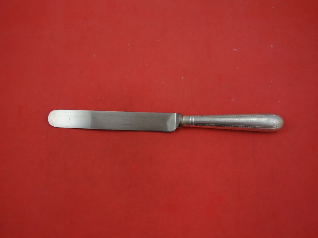 James Robinson Feather Edge Sterling Silver Dinner Knife Blunt Blade 9 1/2": James Robinson Feather Edge Sterling Silver Dinner Knife Blunt Blade 9 1/2" Sterling silver dinner knife in the Feather Edge pattern by James Robinson. It features a blunt stainless blade, is not mono