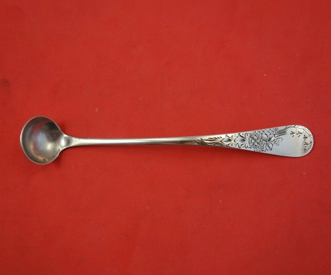 Whiting Sterling Silver Antique Lily Engraved Mustard Ladle 5": Whiting Sterling Silver Antique Lily Engraved Mustard Ladle 5" This exquisite mustard ladle showcases the elegant Antique Lily Engraved pattern by Whiting, a testament to craftsmanship from the late 1