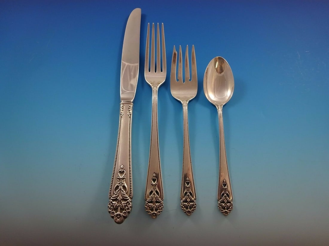 International Silver Queen's Lace 4-Piece Sterling Silver Place Setting: International Silver Queen's Lace 4-Piece Sterling Silver Place Setting Enhance your dining experience with this exquisite 4-piece place setting in the Queen's Lace pattern by International Silver. Cr