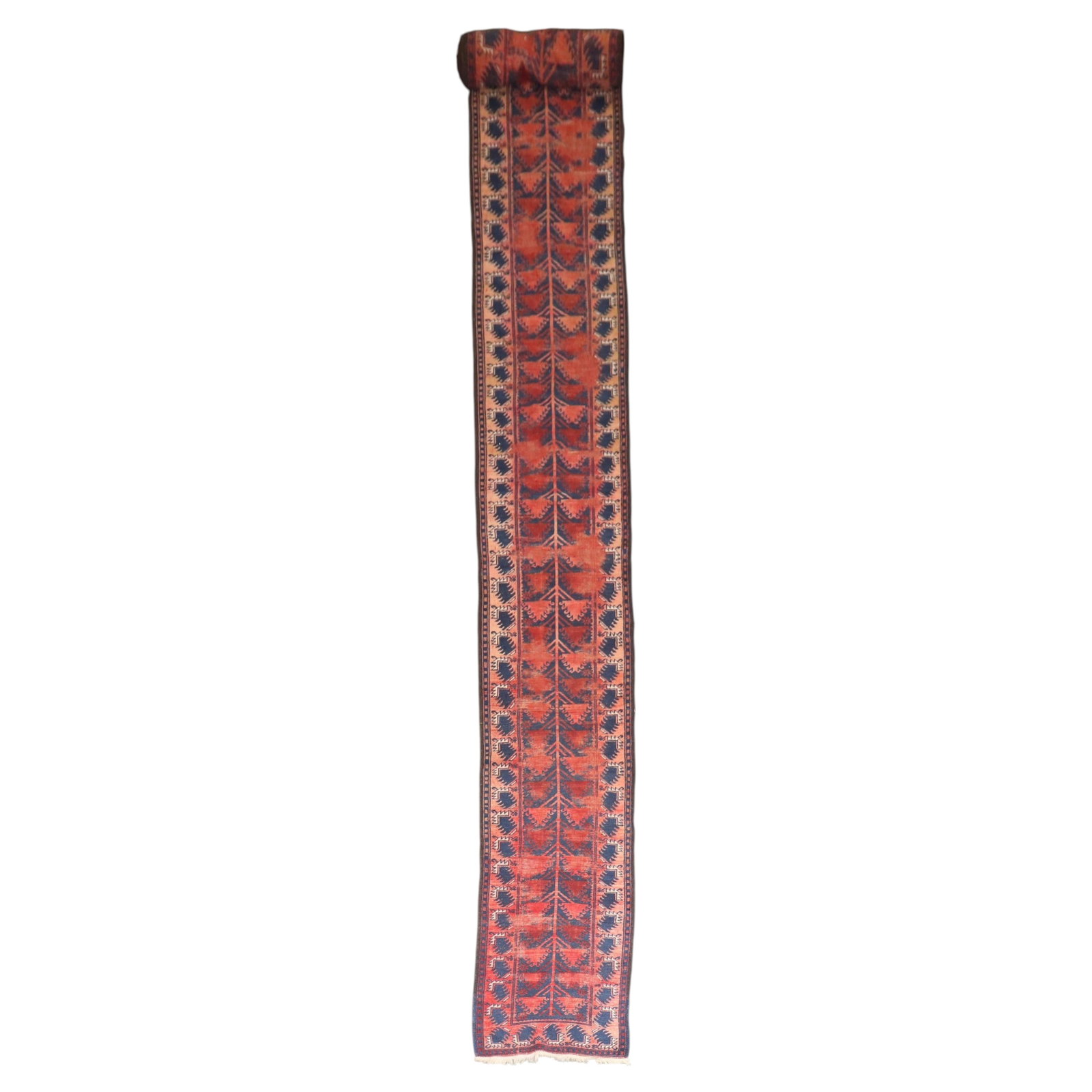 Early 20th Century Balouch Wool Hand Knotted Runner 2 x 19 9: Early 20th Century Balouch Wool Hand Knotted Runner 2 x 19 9 This early 20th-century Balouch runner features a long and narrow design, hand-knotted from wool. The rug showcases a worn, shabby chic app