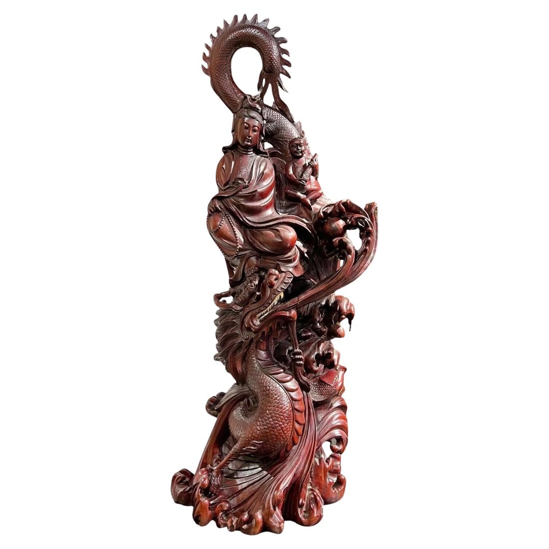Carved Rosewood Quan Yin Statue with Dragon and Figure 50.5 Inches High: Carved Rosewood Quan Yin Statue with Dragon and Figure 50.5 Inches High This monumental vintage sculpture depicts Guanyin, the Buddhist goddess of mercy and compassion, intricately hand-carved from ro