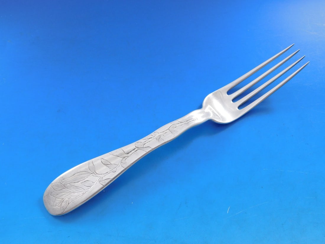 Tiffany Sterling Silver Lap Over Edge Dinner Fork Floral Motif 7 7/8: Tiffany Sterling Silver Lap Over Edge Dinner Fork Floral Motif 7 7/8 This exquisite dinner fork showcases Tiffany & Co.'s renowned craftsmanship in the Lap Over Edge pattern. Made of high-quality ster