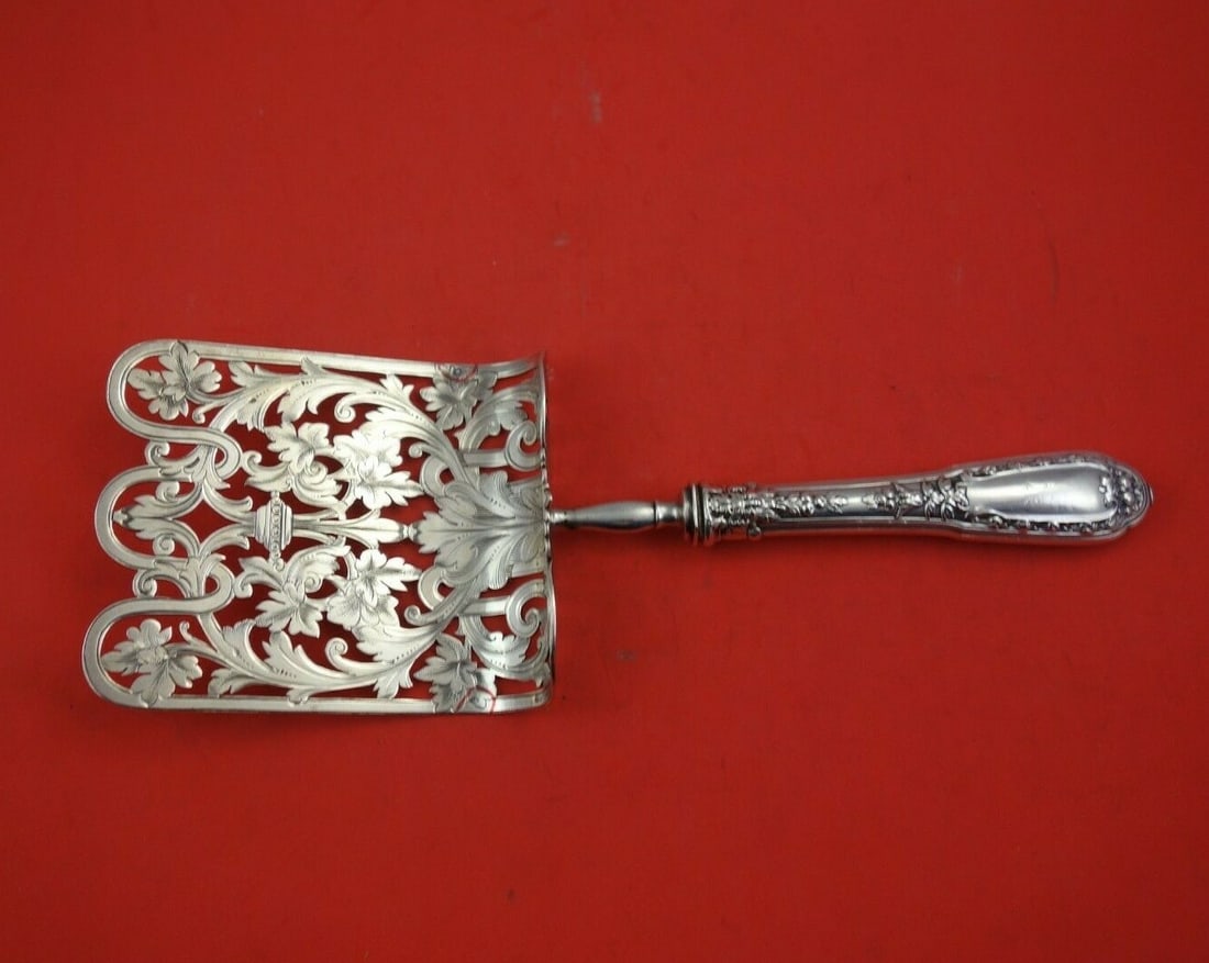 French Sterling Silver 11 Inch Asparagus Server with Fruit Motif: French Sterling Silver 11 Inch Asparagus Server with Fruit Motif This exquisite French asparagus server features a hollow handle crafted from sterling silver, measuring 11 inches in length. The server