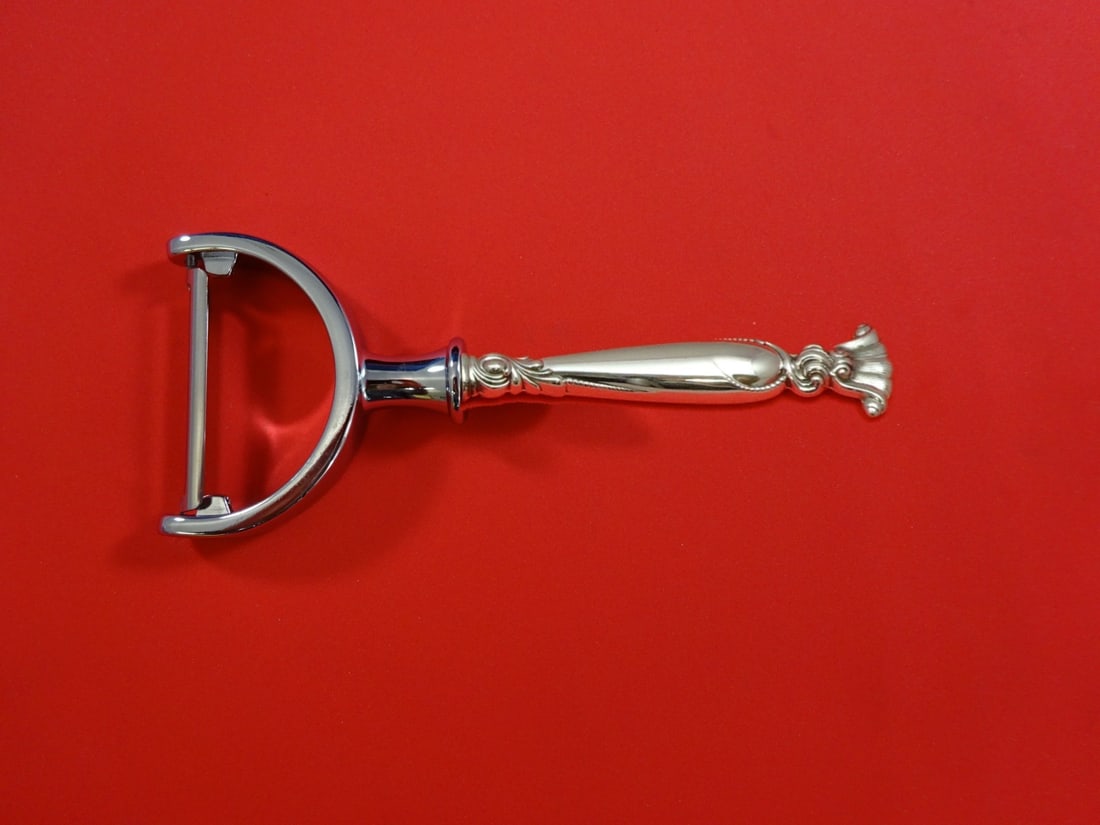 Wallace Romance of the Sea Sterling Silver Vegetable Peeler 6 in: Wallace Romance of the Sea Sterling Silver Vegetable Peeler 6 in A Wallace Romance of the Sea vegetable peeler in sterling silver with a hollow handle and stainless steel implement. It is custom made,
