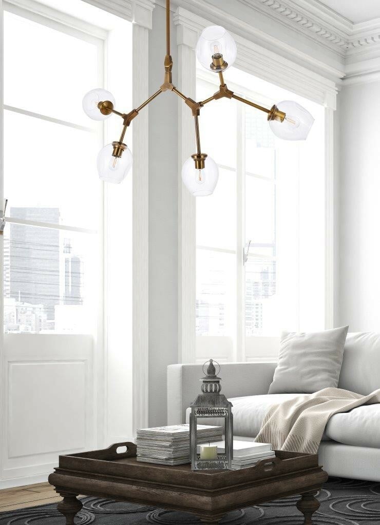Cavoli Brass 5 Light Pendant Chandelier Clear Glass: Cavoli Brass 5 Light Pendant Chandelier Clear Glass This modern chandelier features a brass finish frame with clear glass round shades, offering a sleek and elegant design suitable for various interio