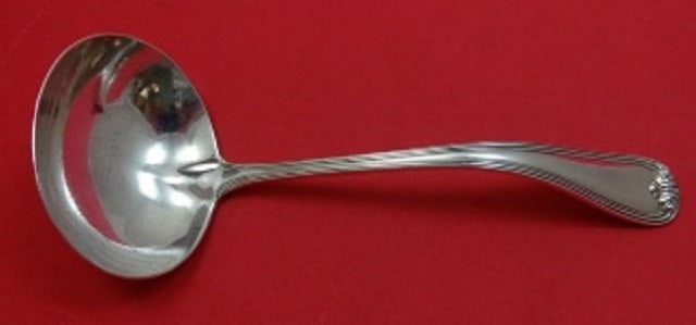 Durgin New Standish Sterling Silver Gravy Ladle 7 1/8 inches: Durgin New Standish Sterling Silver Gravy Ladle 7 1/8 inches This exquisite gravy ladle from the New Standish pattern by Durgin is a beautiful addition to any table setting. Crafted from high-quality 