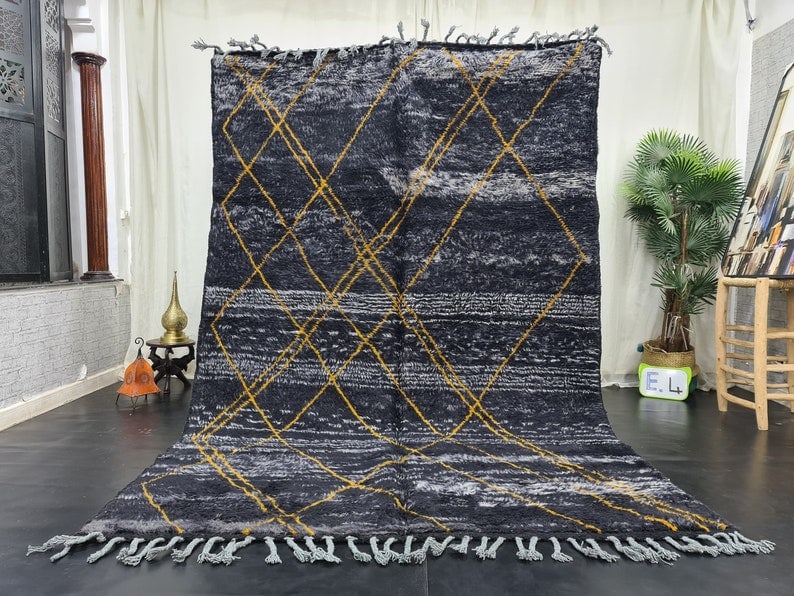 Artistic Black Moroccan Berber Wool Rug with Yellow Geometric Pattern 9.84 x 6.56 Feet: Artistic Black Moroccan Berber Wool Rug with Yellow Geometric Pattern 9.84 x 6.56 Feet Transform your living space with this elegant and artistic handmade Moroccan Berber wool rug. Crafted by local Be