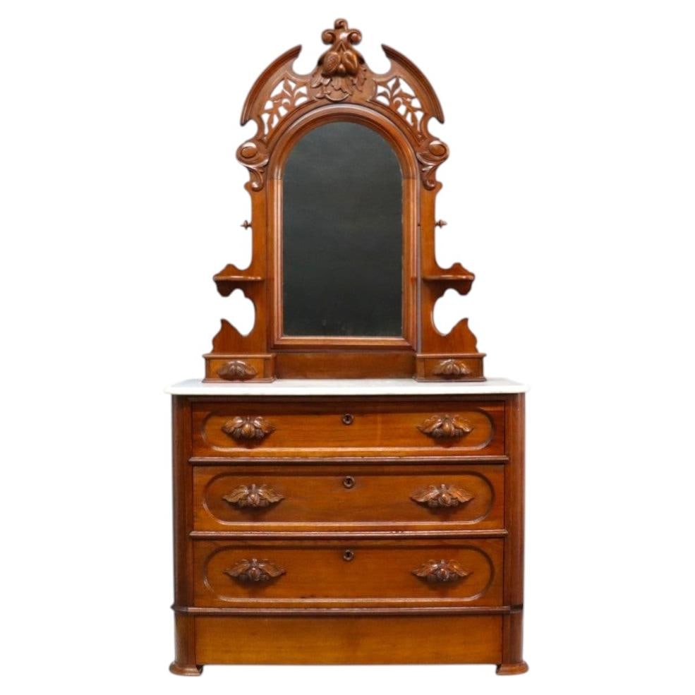 c1880 Walnut Dresser with Marble Top Mirror and Hidden Drawer: c1880 Walnut Dresser with Marble Top Mirror and Hidden Drawer Late 19th century antique dresser circa 1880, crafted in walnut with a polished marble top. It features three primary drawers plus an addi