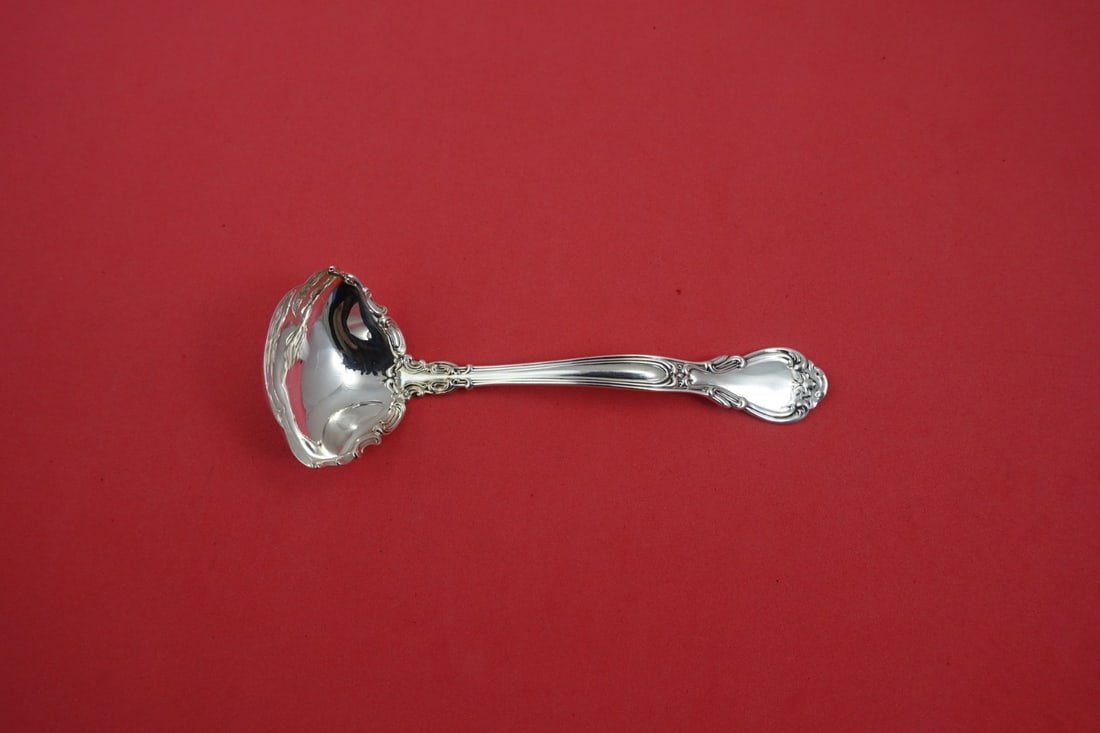 Gorham Chantilly Sterling Silver Sauce Ladle with Applied Lacing 6.25": Gorham Chantilly Sterling Silver Sauce Ladle with Applied Lacing 6.25" This exquisite sauce ladle from the Chantilly pattern by Gorham is crafted from high-quality sterling silver. Measuring 6 1/4 inc