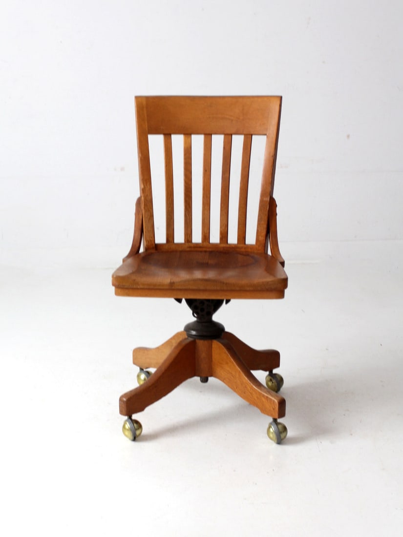 Vintage Oak Swivel Desk Chair by Johnson Chair Co with Gold Casters: Vintage Oak Swivel Desk Chair by Johnson Chair Co with Gold Casters Discover the charm of this Antique Johnson Chair Co Swivel Desk Chair, crafted from oak and originating from Chicago. It features a 