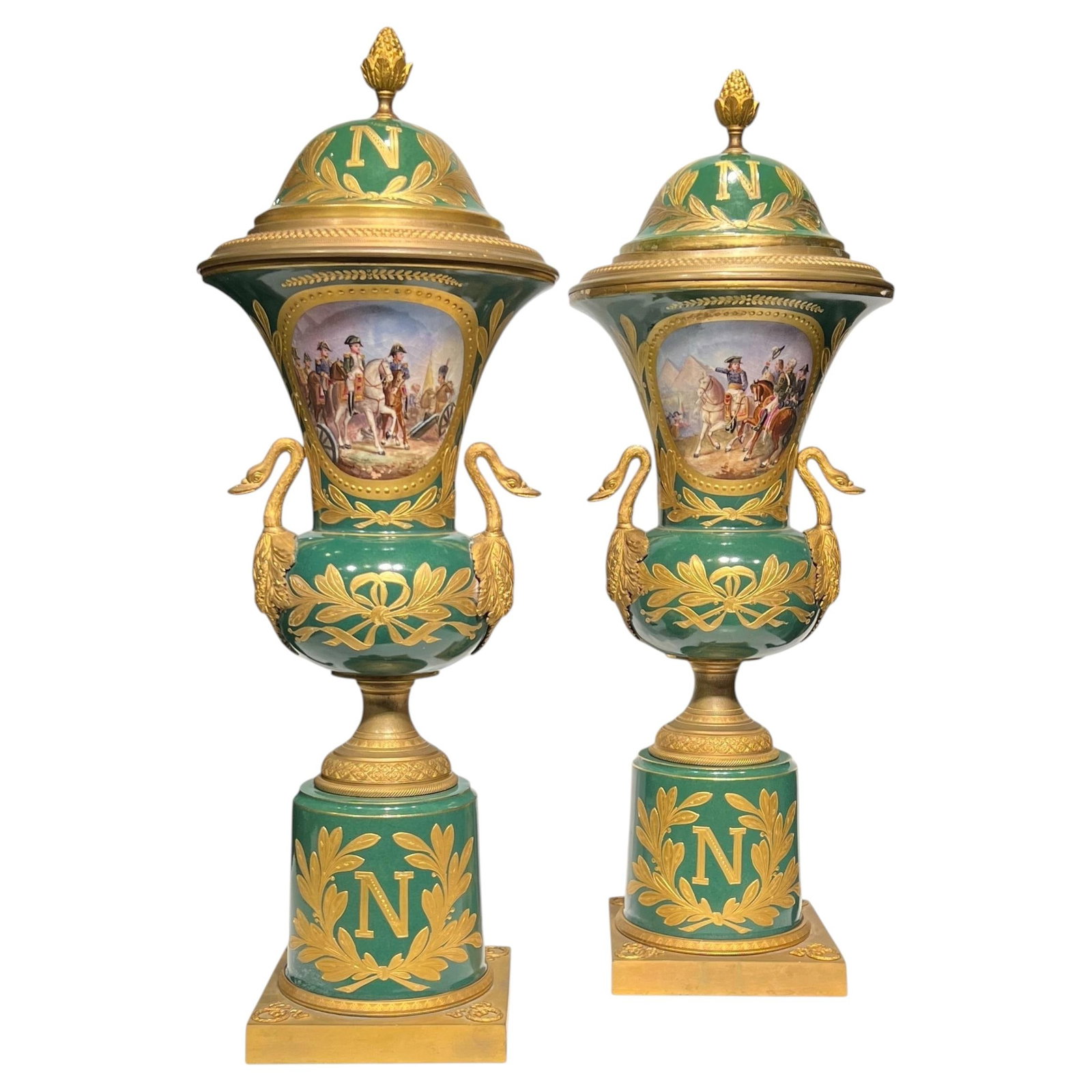 Set of Two French Empire Revival Covered Porcelain Vases with Gilt Bronze Mounts: Set of Two French Empire Revival Covered Porcelain Vases with Gilt Bronze Mounts This pair of antique porcelain vases with covers, dating to the early 20th century, features the Empire Revival style a