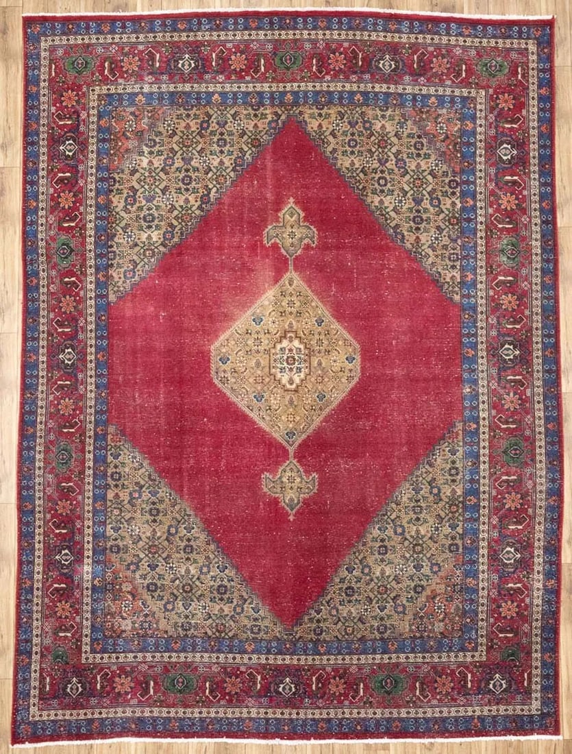 Hand-Knotted Wool Floral Area Rug 10x13 Ft Semi-Antique: Hand-Knotted Wool Floral Area Rug 10x13 Ft Semi-Antique This is a semi-antique, hand-knotted Oriental rug featuring a classic floral pattern in muted tones of red, cream, beige, blue, green, and brown