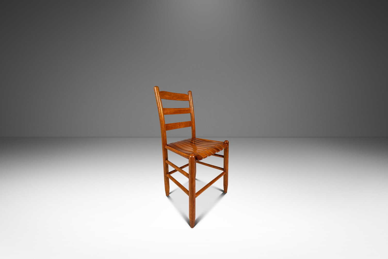 Arthur Umanoff Style Oak Ladder Back Armchair 1960s: Arthur Umanoff Style Oak Ladder Back Armchair 1960s This Mid-Century Modern armchair, crafted in solid oak and designed in the manner of Arthur Umanoff, dates to the 1960s and was made in the USA. The