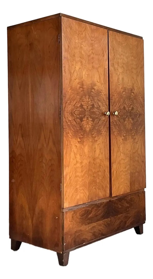 Mid Century Walnut Burlwood Armoire with Brass Pulls: Mid Century Walnut Burlwood Armoire with Brass Pulls This vintage armoire showcases dramatic book-matched burl wood veneers, creating a striking symmetrical grain pattern across its double doors. Feat