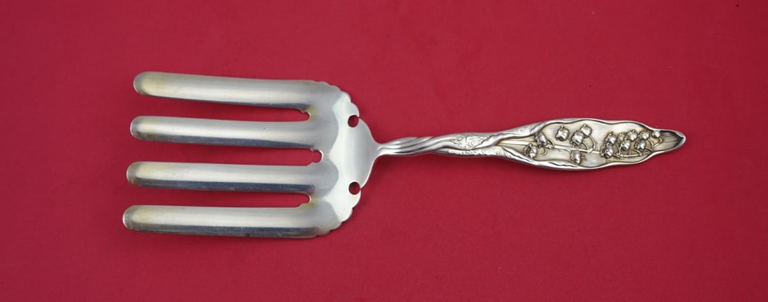 Whiting Lily of the Valley Sterling Silver Asparagus Fork 9 5/8": Whiting Lily of the Valley Sterling Silver Asparagus Fork 9 5/8" This exquisite asparagus fork is part of the renowned Lily of the Valley pattern by Whiting, crafted from sterling silver. The fork mea