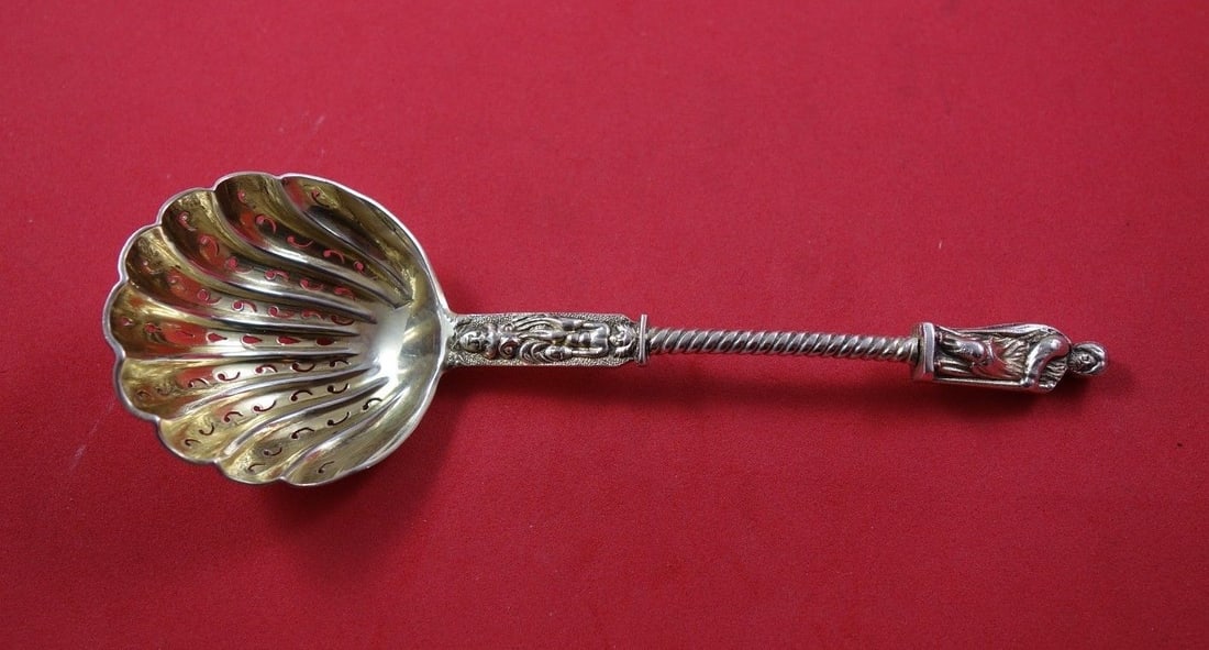 Apostle Sterling Silver Sugar Sifter 6 Inch Gold Washed Scalloped: Apostle Sterling Silver Sugar Sifter 6 Inch Gold Washed Scalloped This exquisite Apostle sugar sifter is crafted from sterling silver and features a stunning gold wash. With a pierced and scalloped