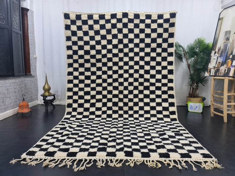 Handwoven White Black Soft Rug 100 Local Sheep Wool Morocco 10 x 5 Feet: Handwoven White Black Soft Rug 100 Local Sheep Wool Morocco 10 x 5 Feet Experience the warmth and artistry of the Atlas Mountains with this authentic White & Black Soft Rug. Handwoven by local Berber 