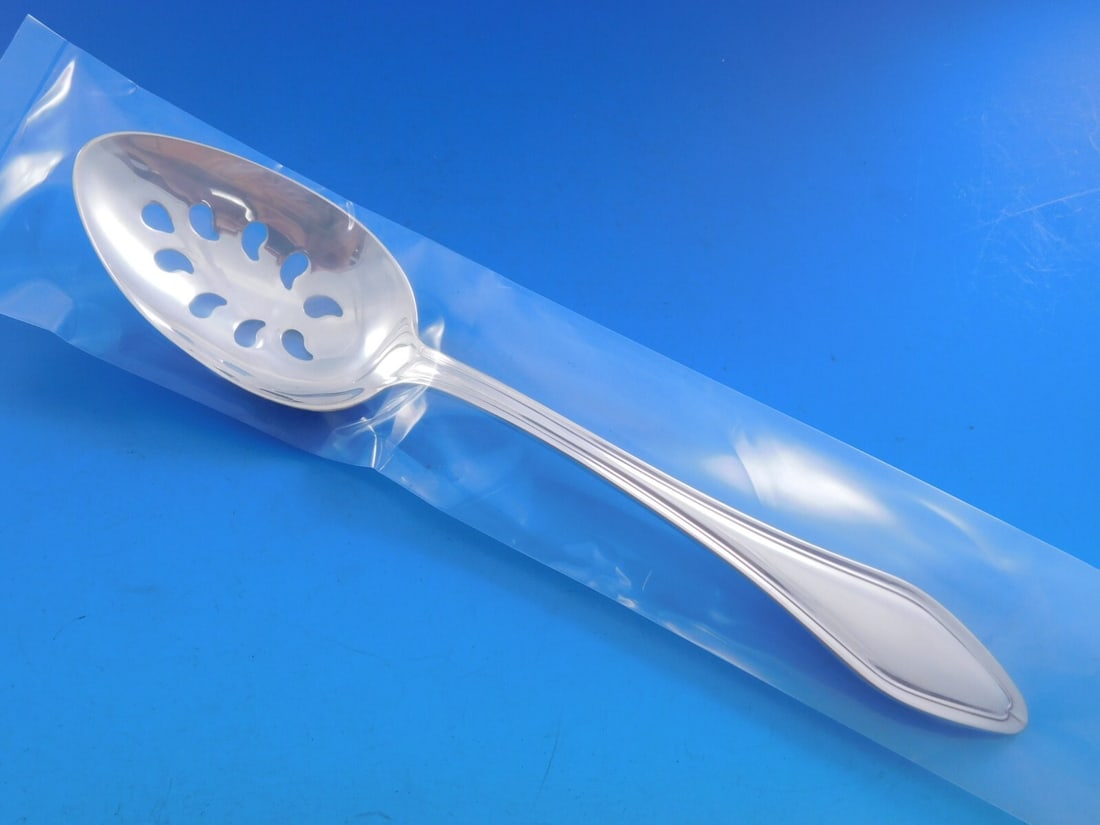 Towle Sterling Silver Serving Spoon Mary Chilton Pattern 9-Hole 8 1/4": Towle Sterling Silver Serving Spoon Mary Chilton Pattern 9-Hole 8 1/4" This exquisite serving spoon features the elegant Mary Chilton pattern by Towle, crafted from high-quality sterling silver. Measu