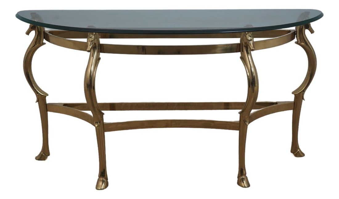 Horse Head Demilune Console Table Brass Glass 58w x 19d x 30h: Horse Head Demilune Console Table Brass Glass 58w x 19d x 30h A brass and glass horse head demilune console table with a hoof foot, beveled glass, solid brass hardware, and a stretcher base frame. The